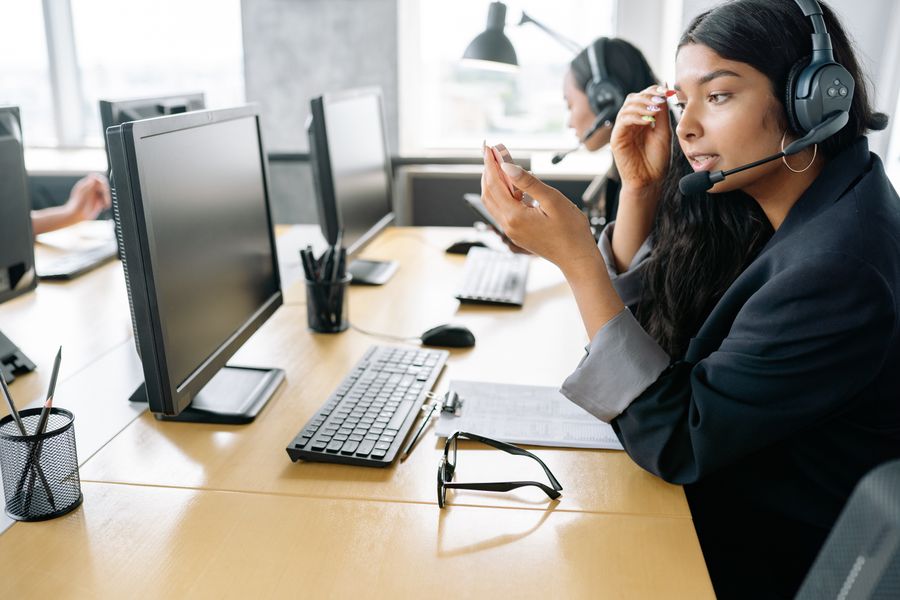 Limitise customer support agent taking a call on her headset